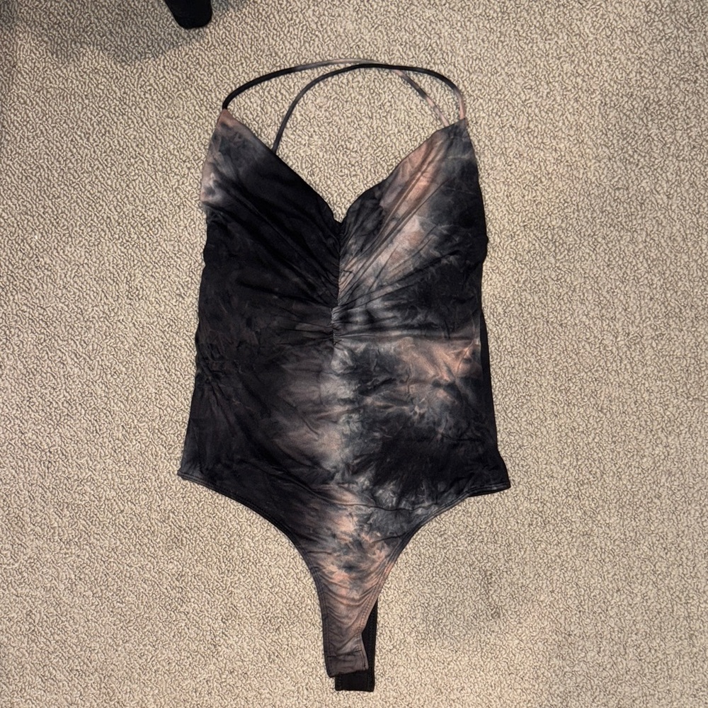 Pink and black body suit with open back
